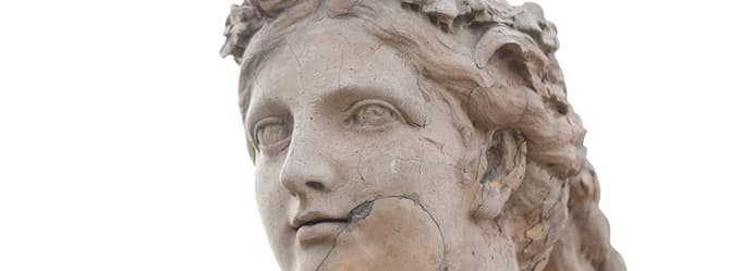 Gently polishing an antique silver teapot.